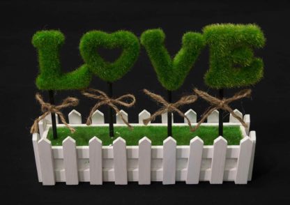 love topiary hedge picket fence