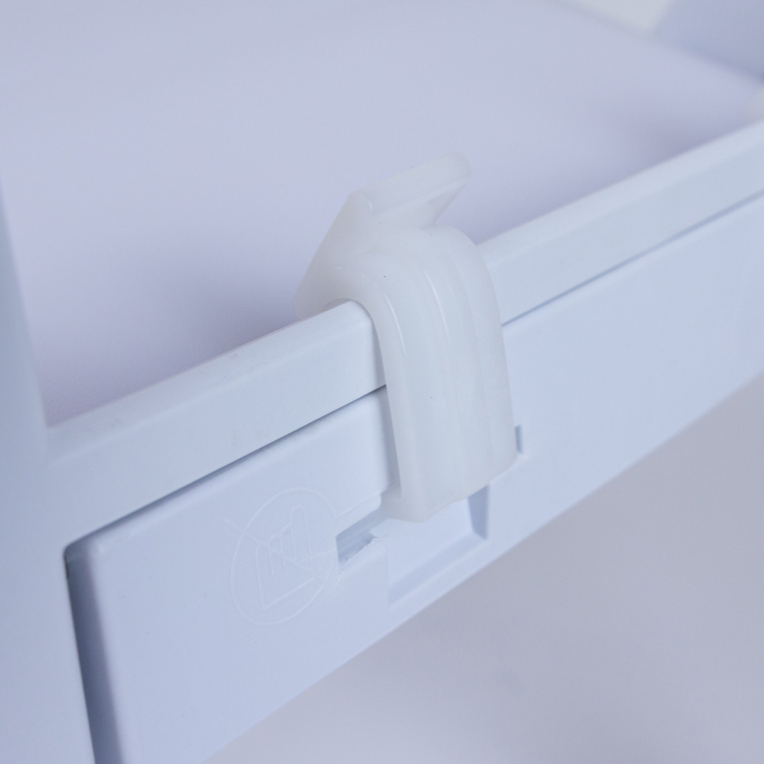 Close-up of white Child Size Americana Chair hinge and locking mechanism – durable polypropylene construction ensures safe and secure folding for event use.