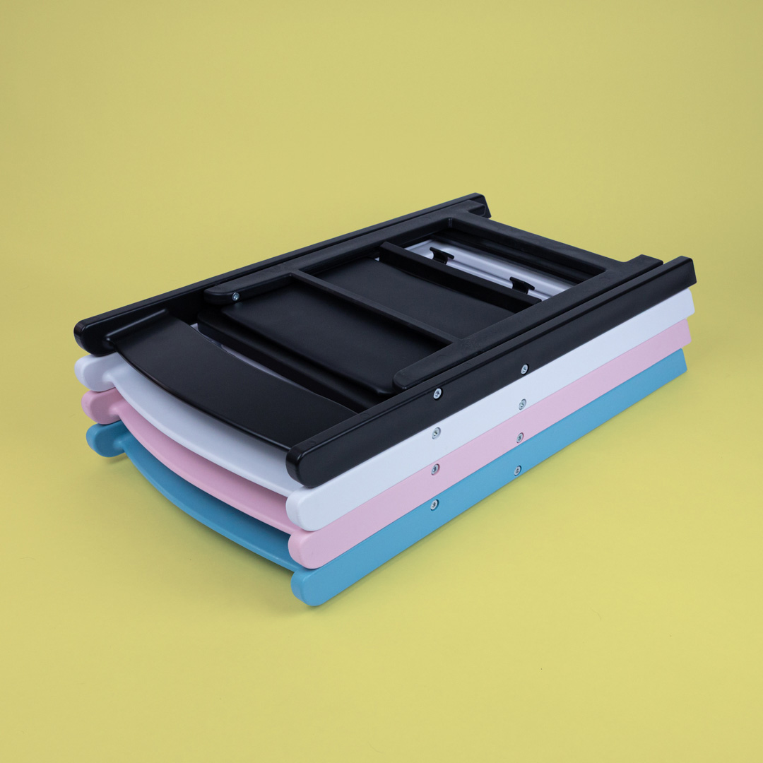 Stack of Child Size Americana Chairs in black, white, pink and blue – compact folding event chairs designed for children, easy to stack and transport for indoor or outdoor use.