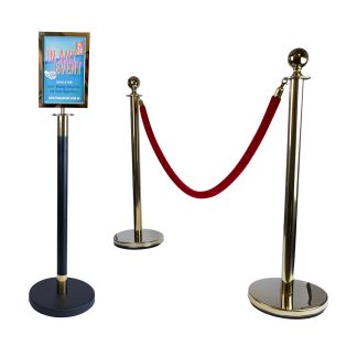 Gold velvet rope stanchion setup with an A4 sign holder attached to black and gold post with red velvet rope between bollards for VIP crowd control