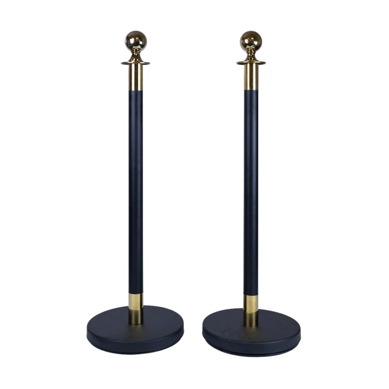 Pair of black and gold stanchion bollards without ropes showing base and post design for velvet rope barrier system