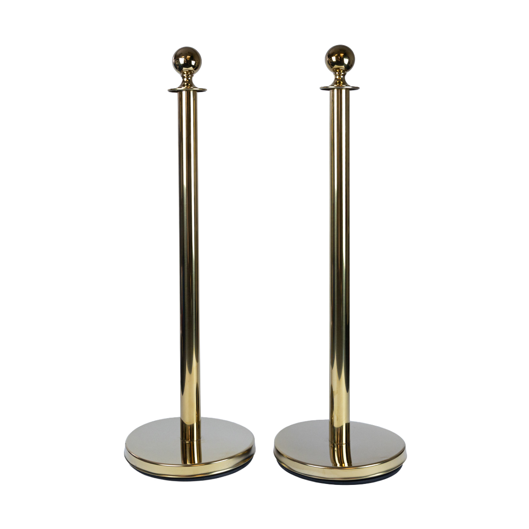 Pair of polished gold stanchion posts without rope showing reflective gold finish for premium velvet rope crowd barrier