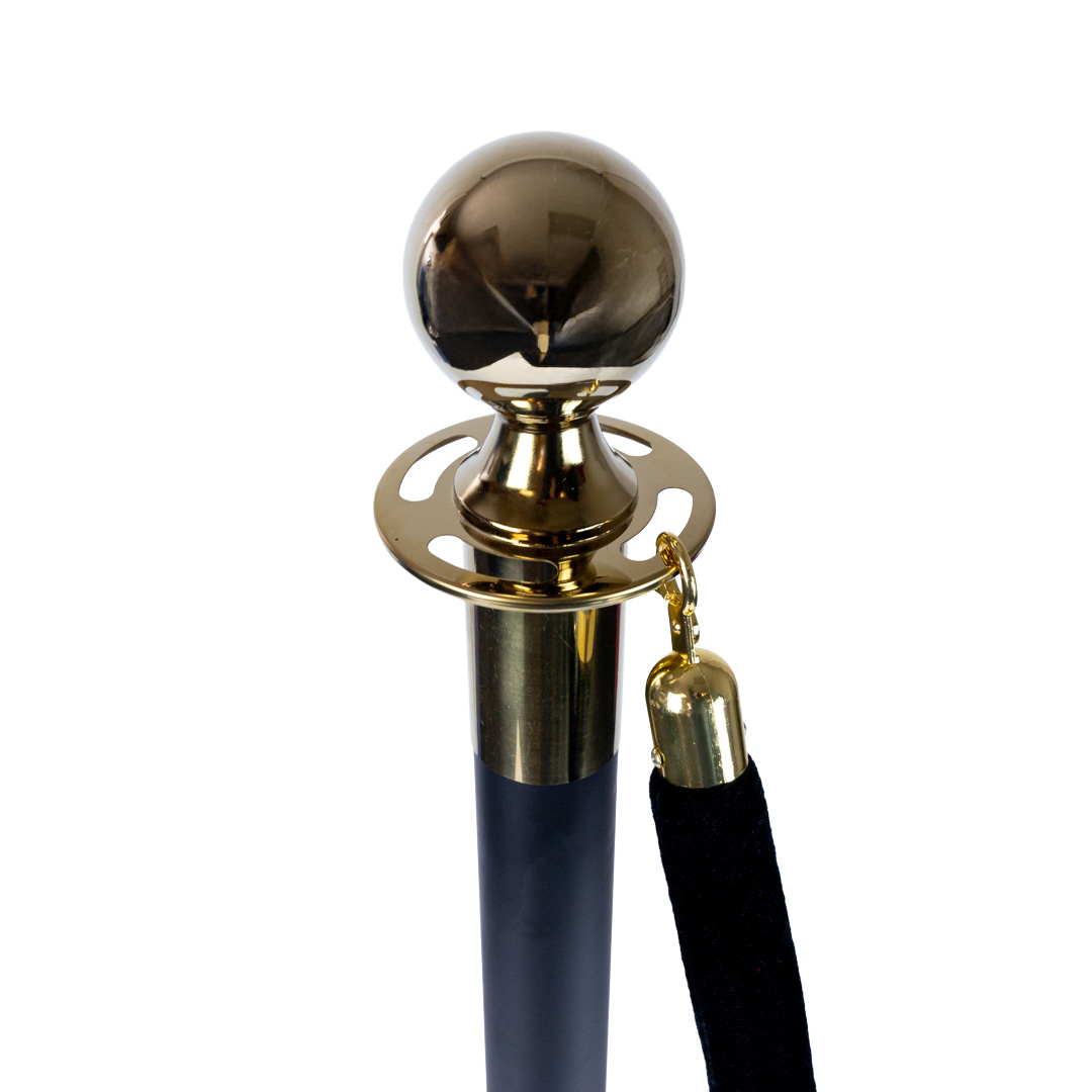 Close up of gold stanchion top showing hook attachment point and black velvet rope clip for VIP queue barrier system