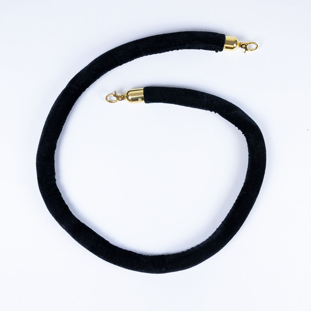 Black velvet stanchion rope with gold clip hooks for premium VIP crowd control barrier system used in venues shops and events