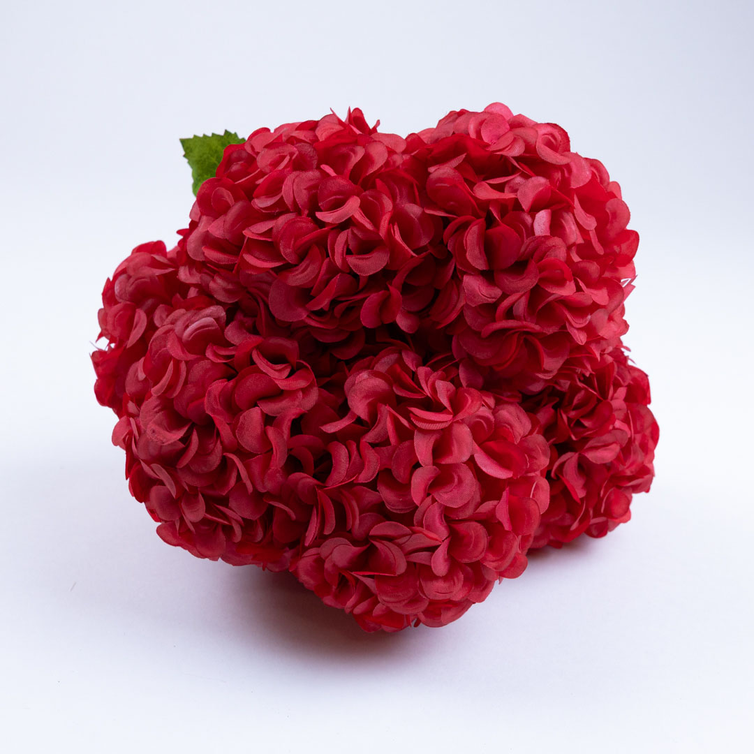 Close up artificial red hibiscus flower heads showing realistic texture and full bloom design for decorative arrangements