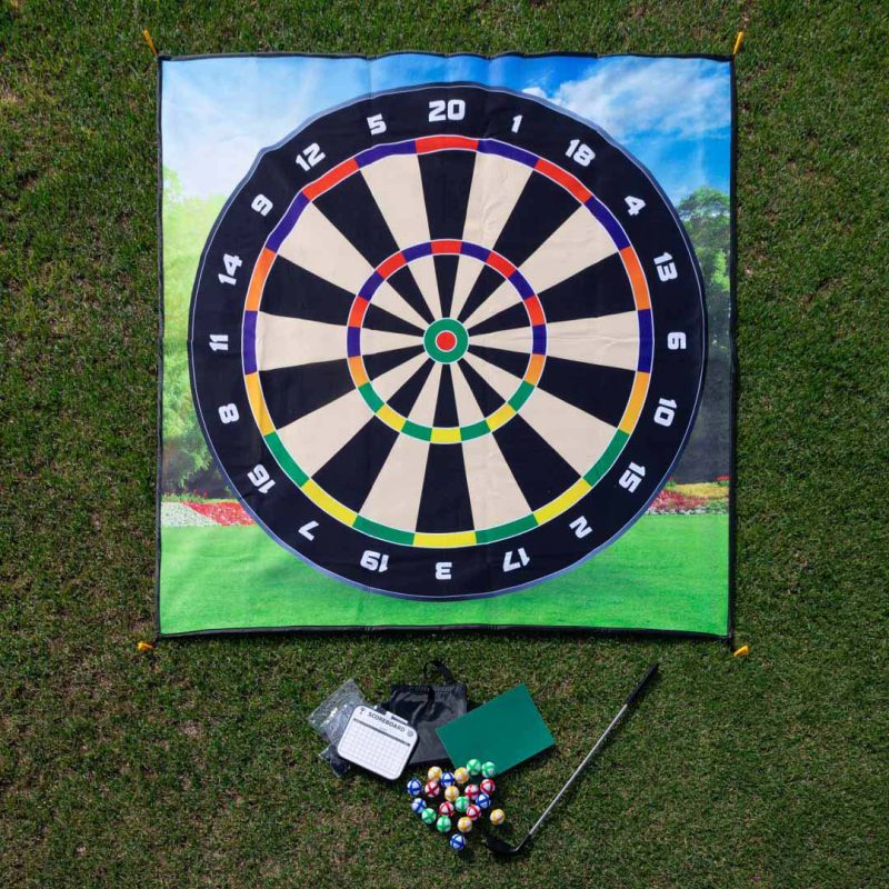 Velcro Golf Dartboard Chipping Game set laid out on grass with mat, golf balls, club, and scoreboard