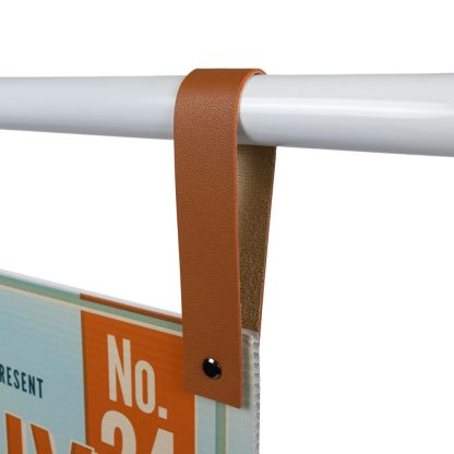 Tan Faux Leather Strap Close-Up Showing Secure Fit Around Metal Bar for Hanging Signs