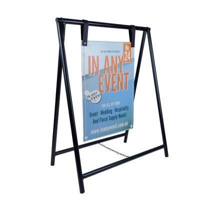 Angled view of black metal A-frame sign stand with hanging signage, ideal for weddings, events, and retail displays.