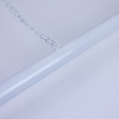 Detailed view of white metal A-frame signage stand support chain welded to base bar for added stability.