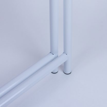 Bottom frame detail of white metal A-frame signage stand highlighting strong welded joints and balanced structure.
