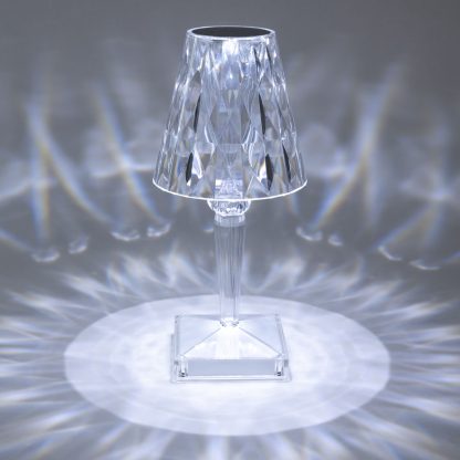 Cordless crystal touch lamp displaying bright cool white LED glow with stunning reflective pattern, ideal for bedside or restaurant tables.