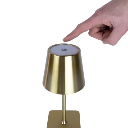 Close-up of gold LED touch lamp showing fingertip touch control button on top – rechargeable metal lamp with tri-colour LED light.
