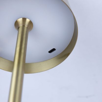 Bottom view of gold metal LED touch lamp showing USB-C charging port – rechargeable cordless table lamp for events, restaurants, and home lighting.