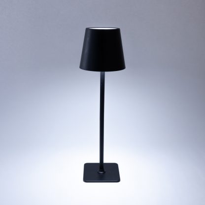 Black rechargeable LED touch table lamp showing cool white tri-colour light – cordless metal lamp for modern home or hospitality settings.