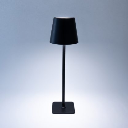 Black metal LED touch control table lamp illuminated with neutral light tone – adjustable height rechargeable lamp for events and dining tables.