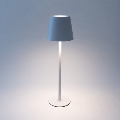 White LED touch table lamp emitting soft warm light – rechargeable metal lamp with touch dimmer ideal for bedside or café use.