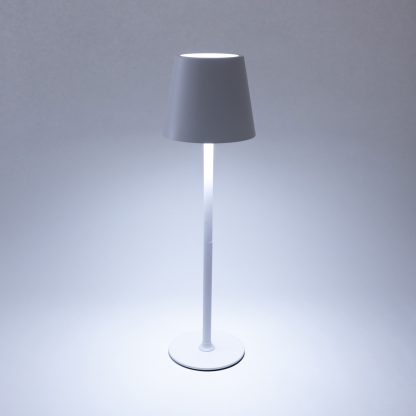 White rechargeable LED touch table lamp showing cool white light – cordless adjustable height lamp for modern event or restaurant lighting.