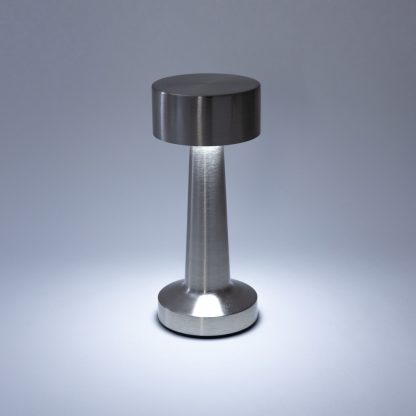 Silver rechargeable mushroom LED table lamp turned on with bright cool white lighting