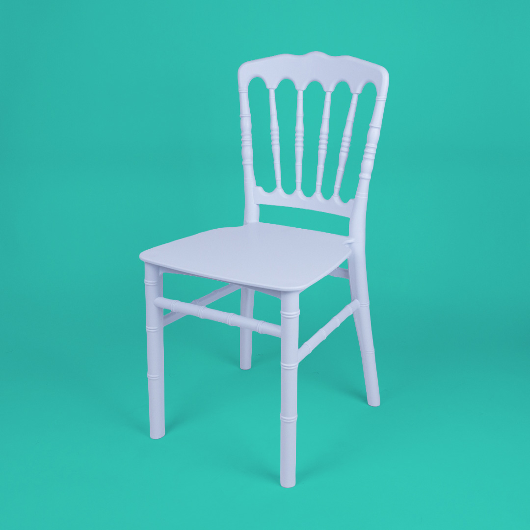 White child size Napoleon chair made from sturdy resin, shown at an angle on a teal background – lightweight stackable kids event chair for weddings and parties.