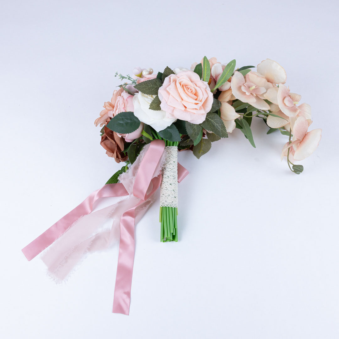 Pink and peach artificial bridal bouquet with ivory accents and satin and lace ribbon wrap, realistic tear drop bouquet perfect for wedding bouquet toss.
