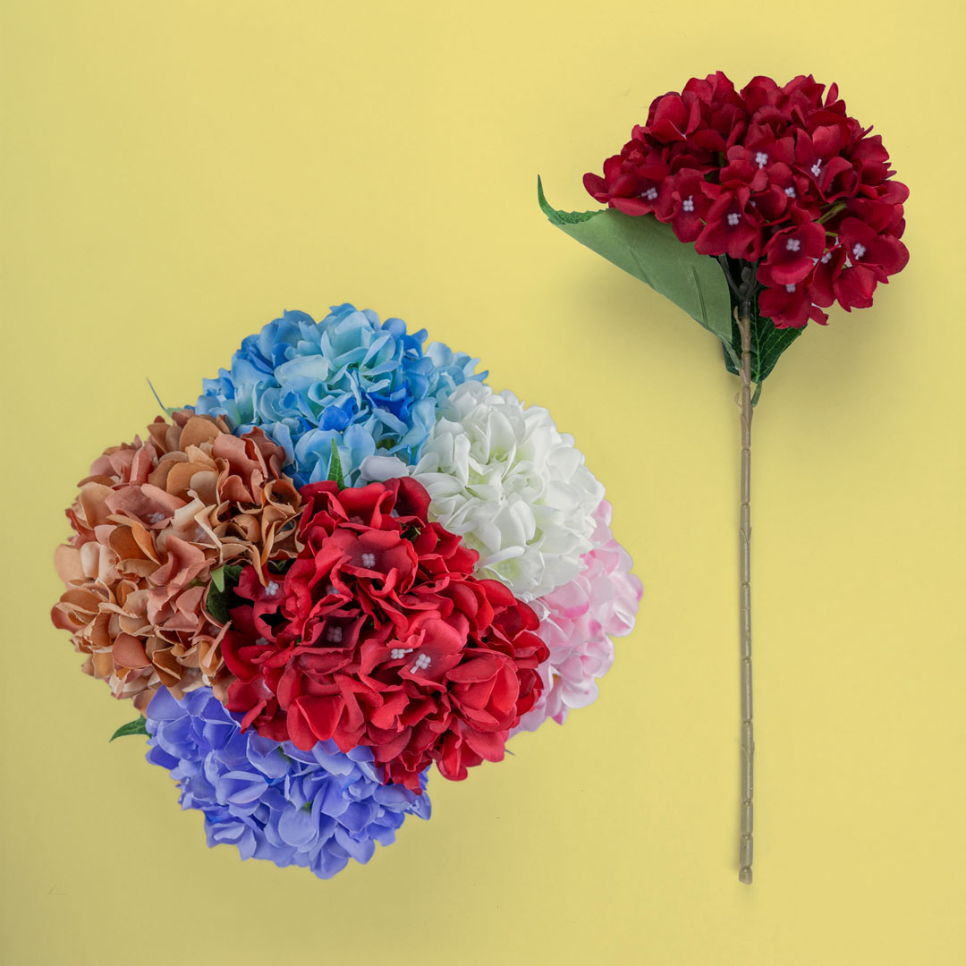 Assorted artificial hydrangea stems in pink, ivory, red, rust, blue, and purple displayed together, showcasing 45 cm faux hydrangea flower options.