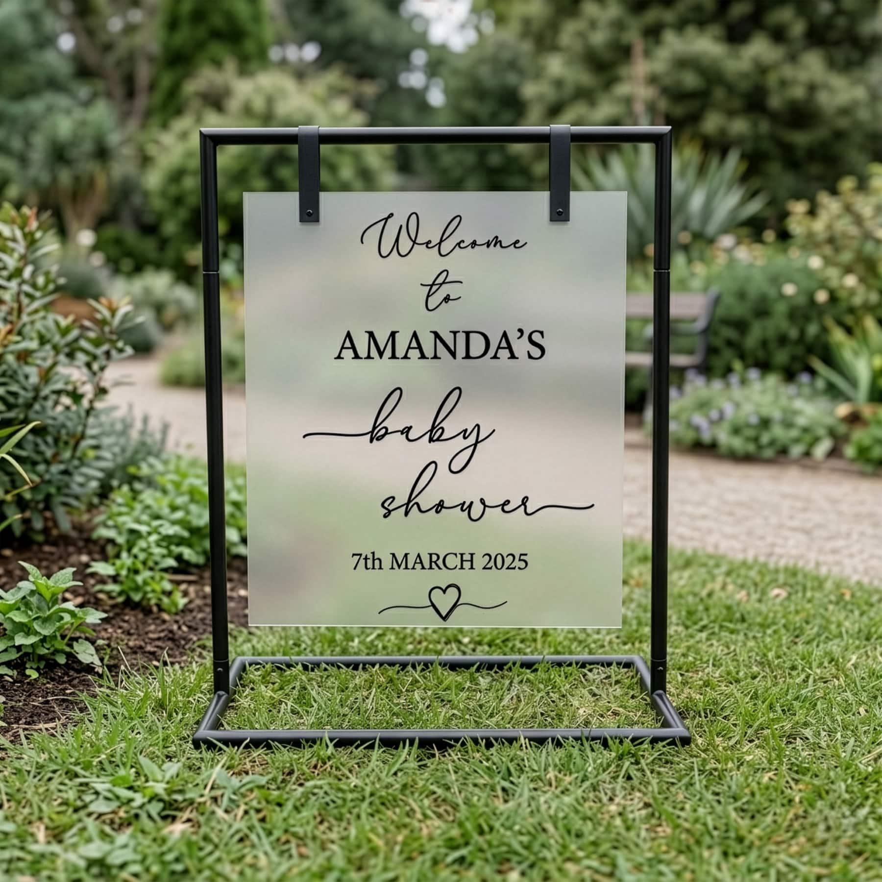 Frosted acrylic sign board 59 x 68cm displayed on black metal sign stand for outdoor baby shower signage