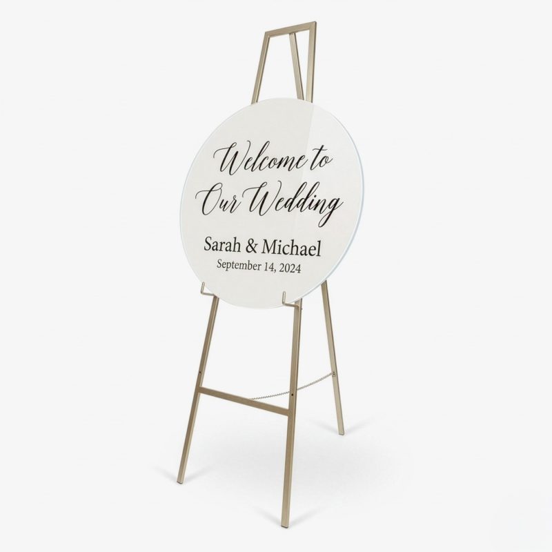 White gloss round acrylic sign board 60cm styled on gold stand angled view